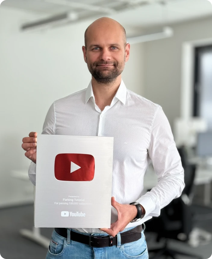 Juri holding silver YouTube award